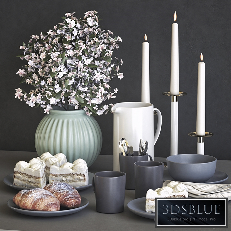 A set of dishes IKEA with a croissant and cake