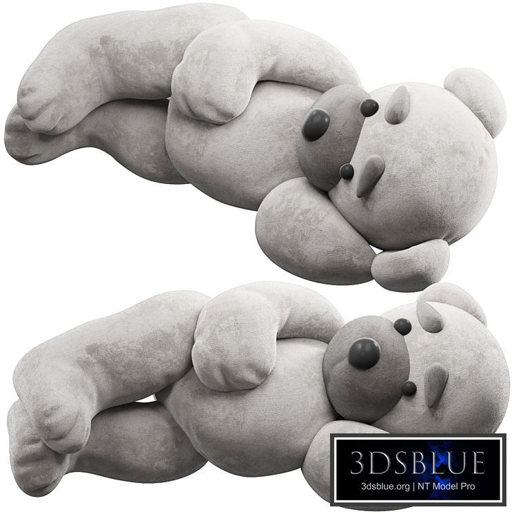 soft toy bear lies on its side